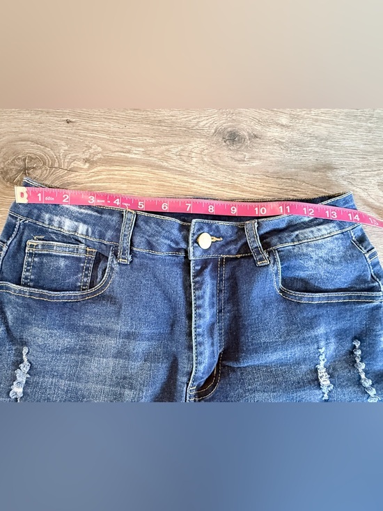 Distressed High-Rise Denim Shorts in Blue - Picture 3 of 7